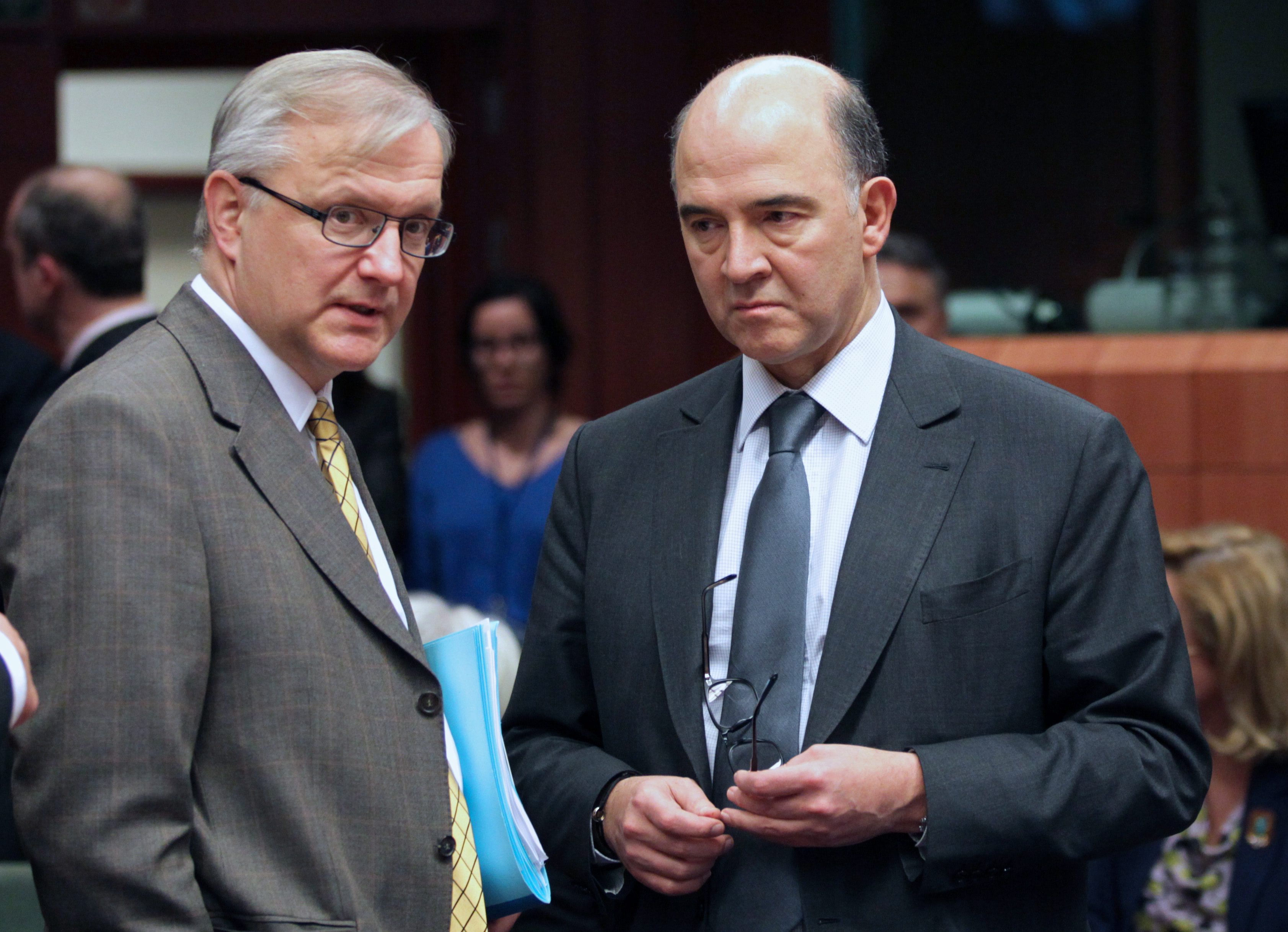 Pierre Moscovici (à droite) et Olli Rehn, ici en mars 2013 © Maxppp